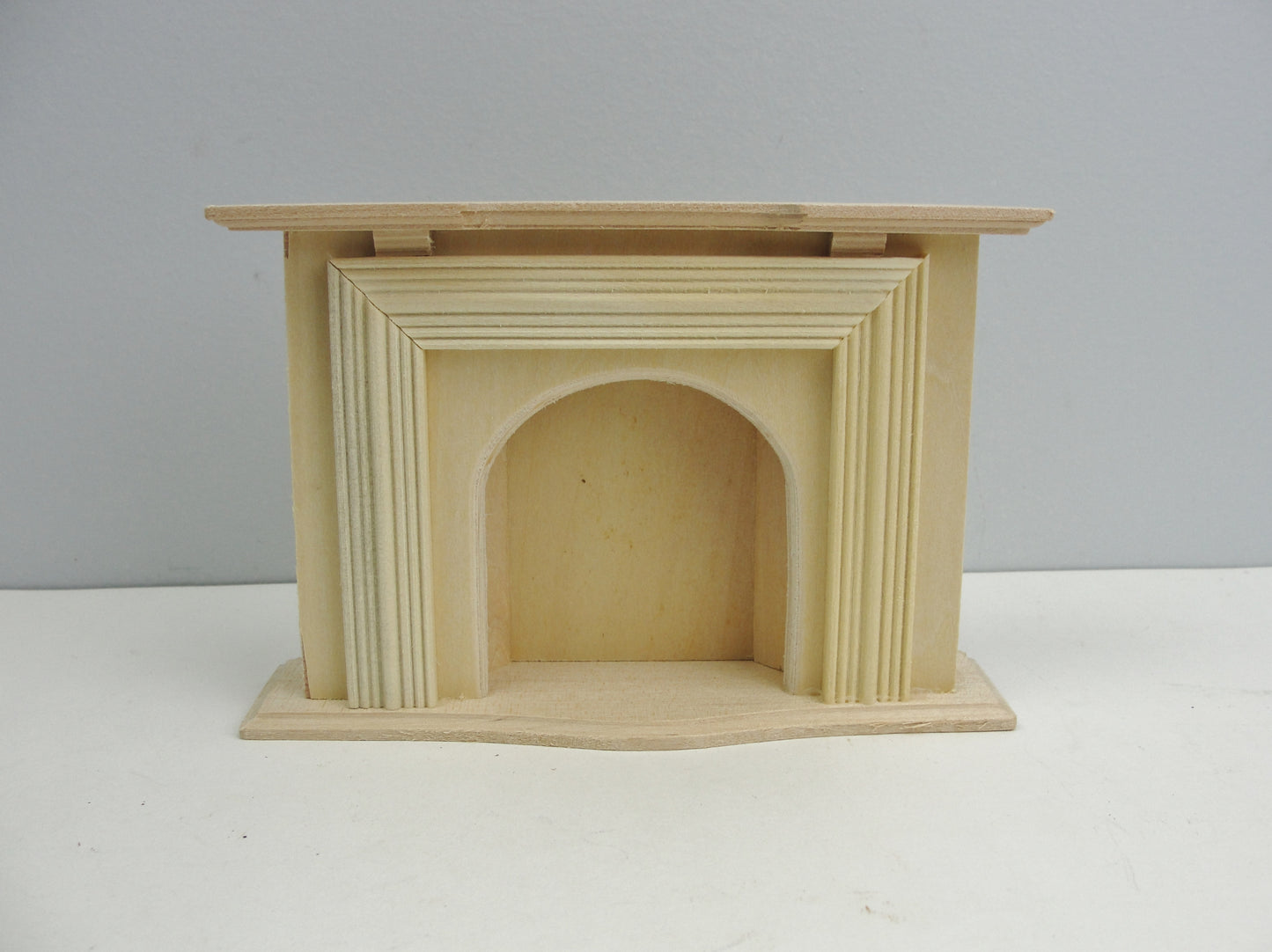 Unfinished dollhouse fireplace