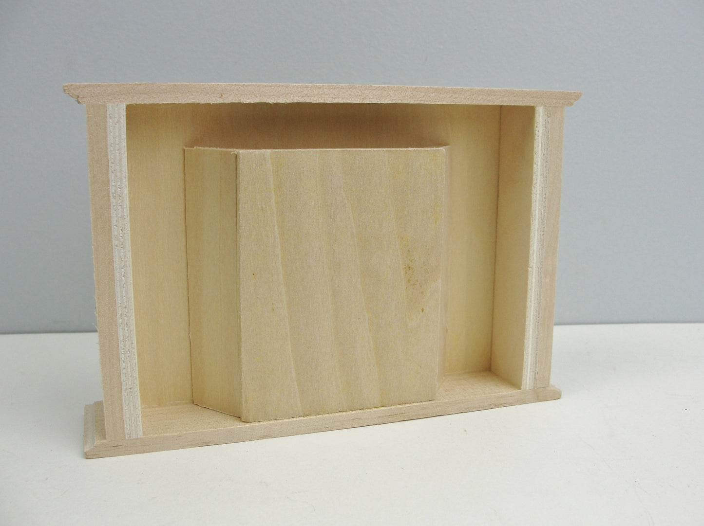 Unfinished dollhouse fireplace