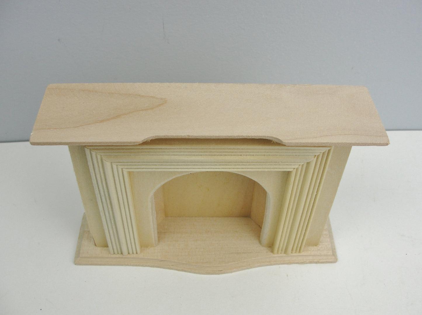 Unfinished dollhouse fireplace