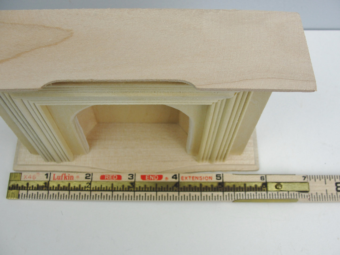 Unfinished dollhouse fireplace