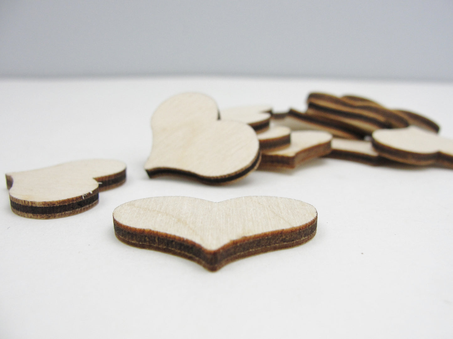 12 Wooden country hearts 1 1/4 inch (1.25") wide 1/8" thick