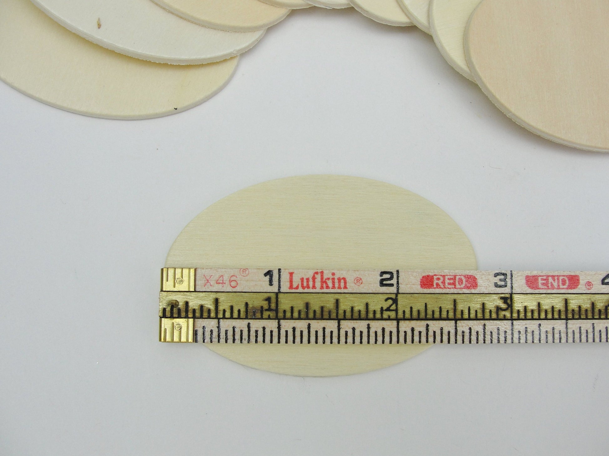 Wood oval disc 2 3/4" x 1 3/4" set of 10 - Wood parts - Craft Supply House