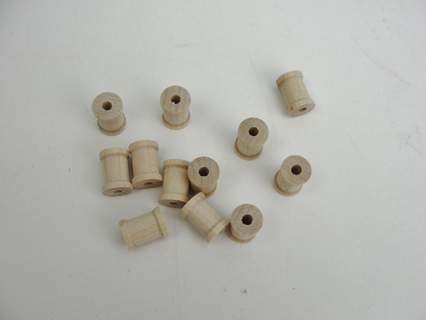 Little wooden spools 1/2" x 3/8" set of 12, wood spools