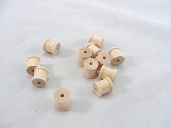 Little wooden spools 1/2 inch set of 12 - Wood parts - Craft Supply House