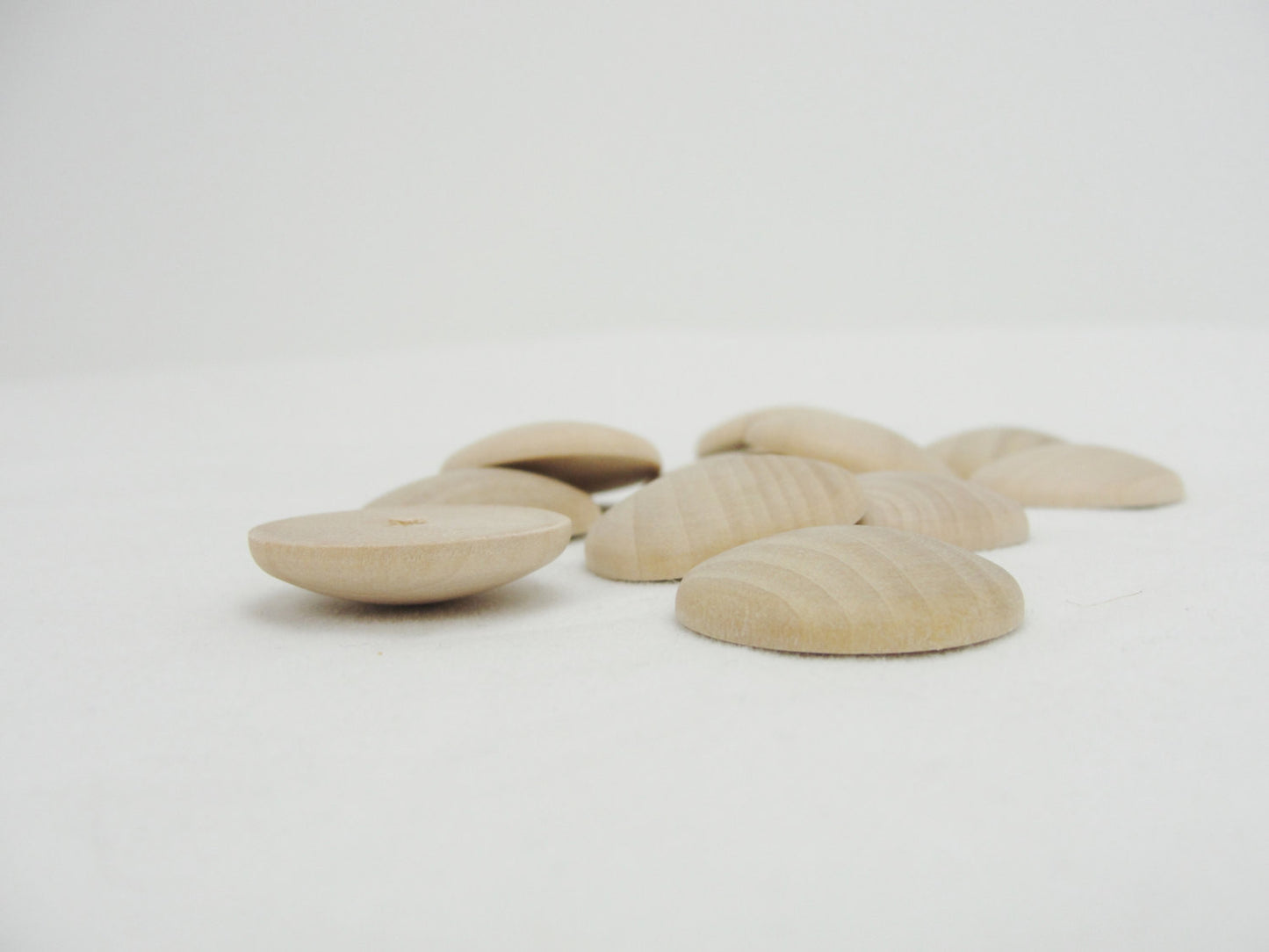 Domed wooden Circles 1" wide x 3/16" thick set of 12 - Wood parts - Craft Supply House
