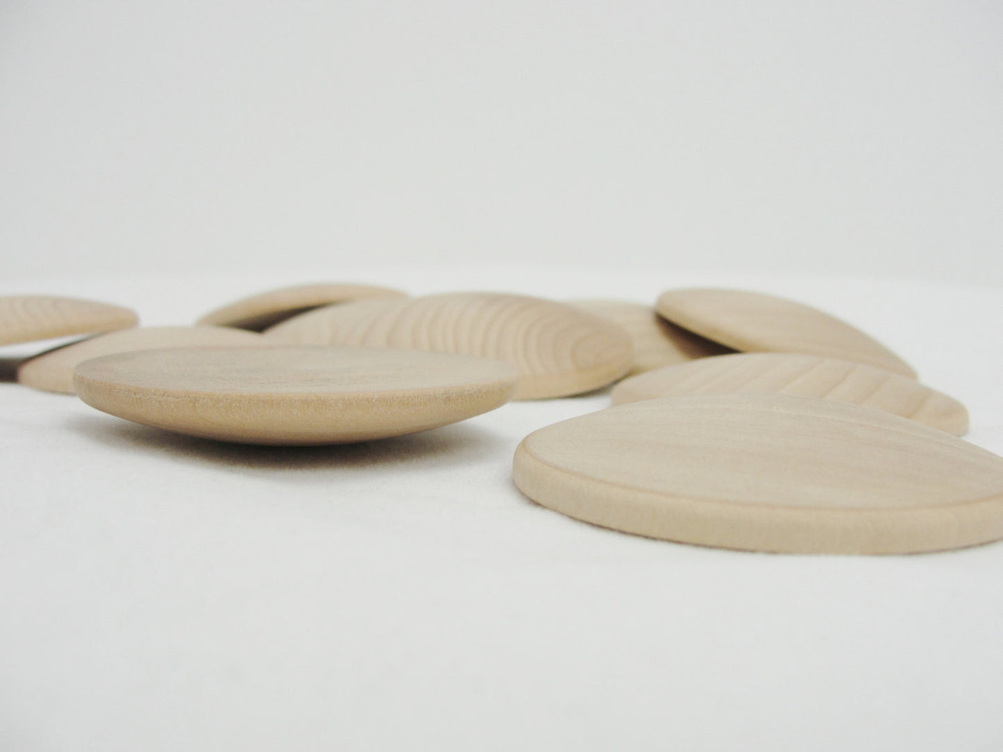 Domed wood disc 2" wide x 5/16" thick set of 12 - Wood parts - Craft Supply House