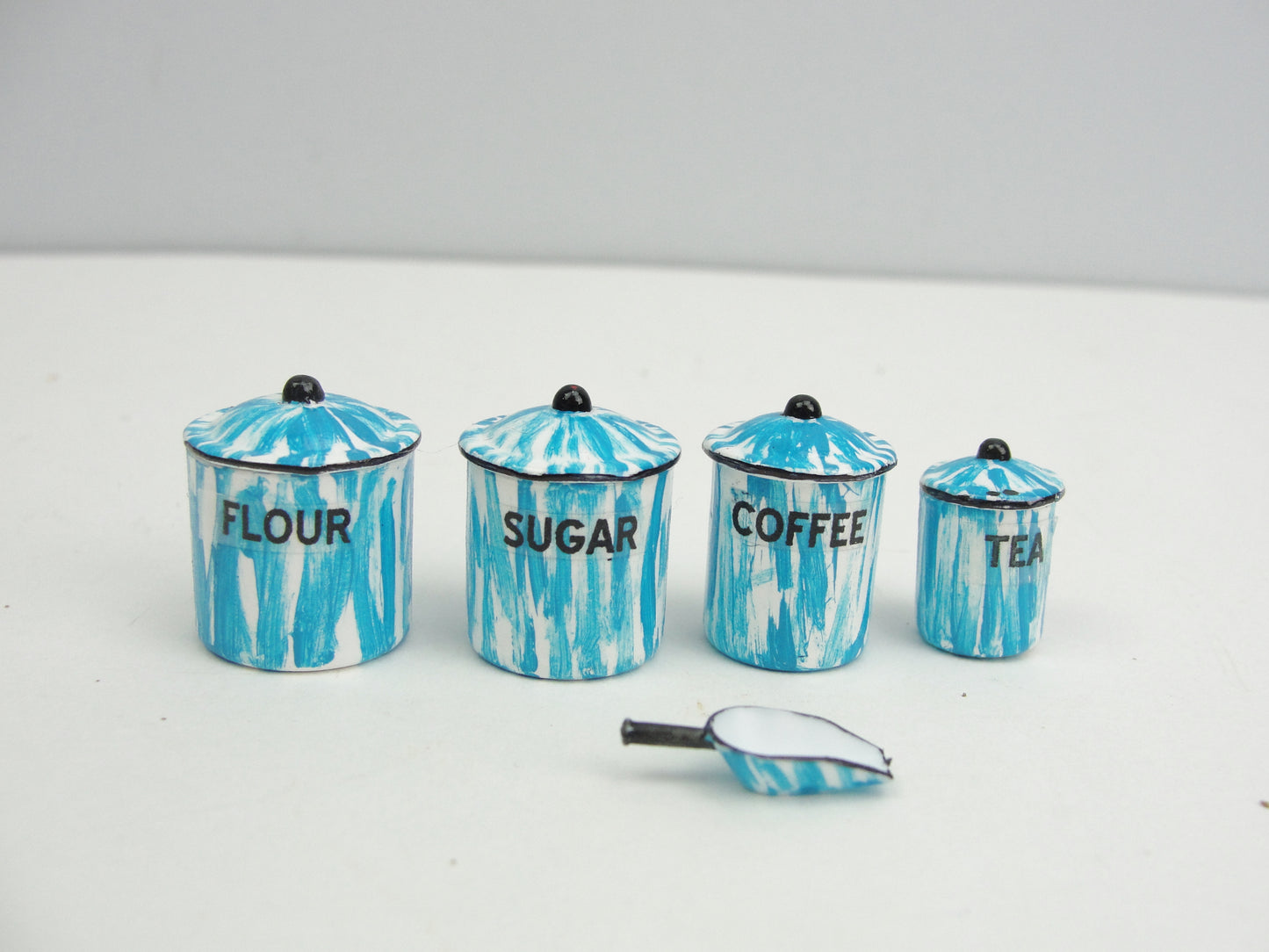 Miniature flow blue, red, or green canister set