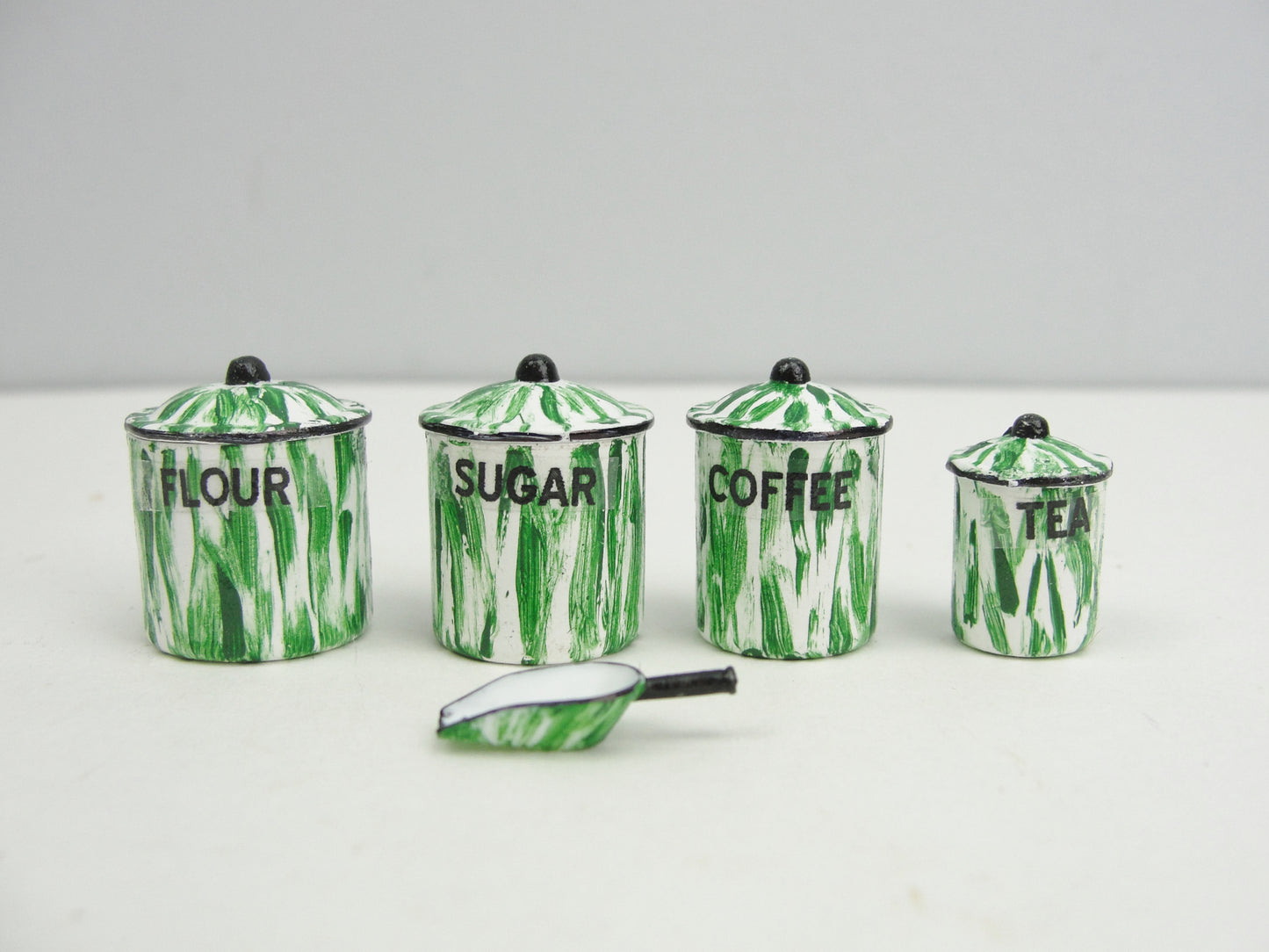 Miniature flow blue, red, or green canister set