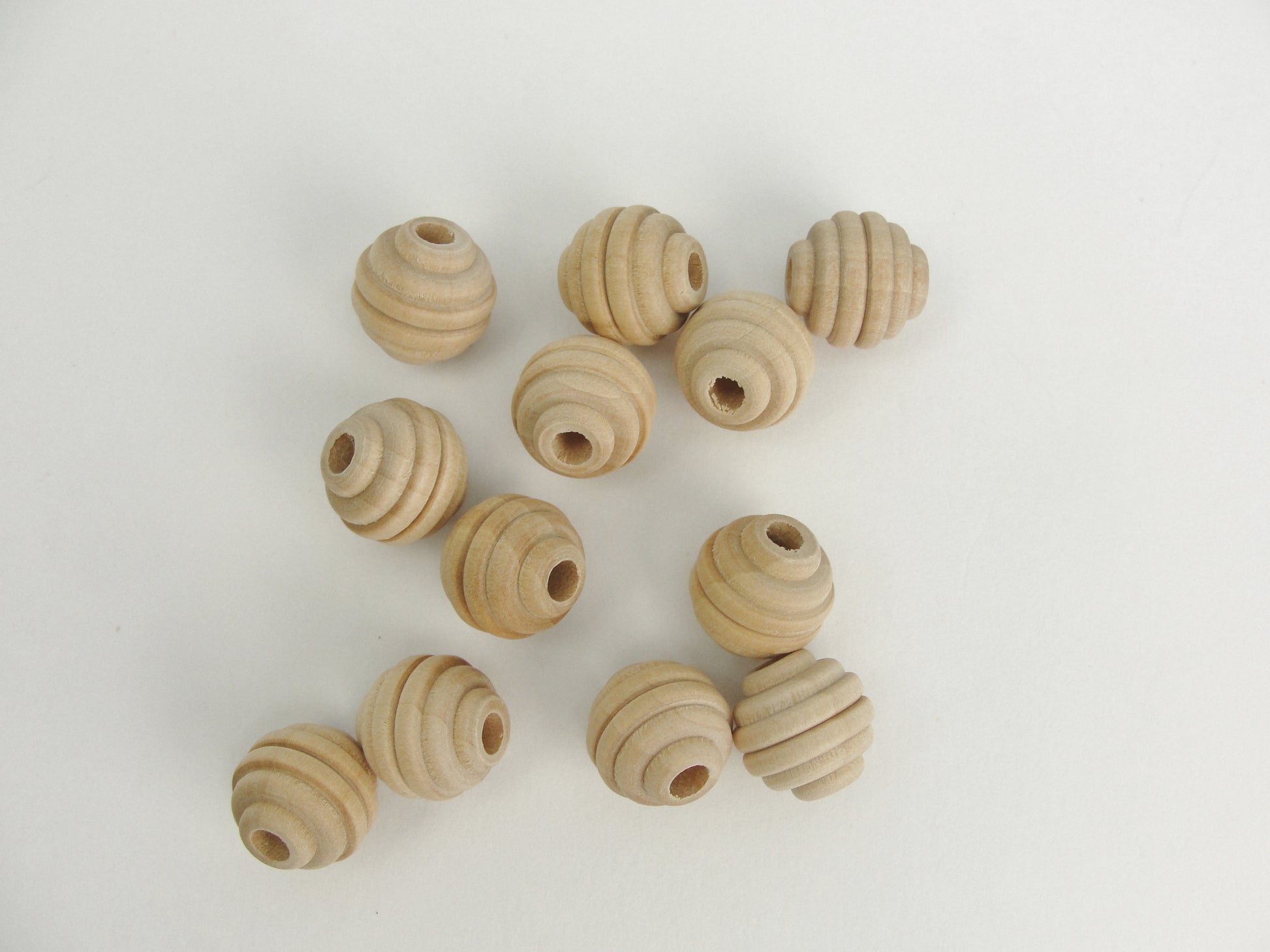 Wood beehive beads 5/8" with a 3/16" hole - Wood parts - Craft Supply House