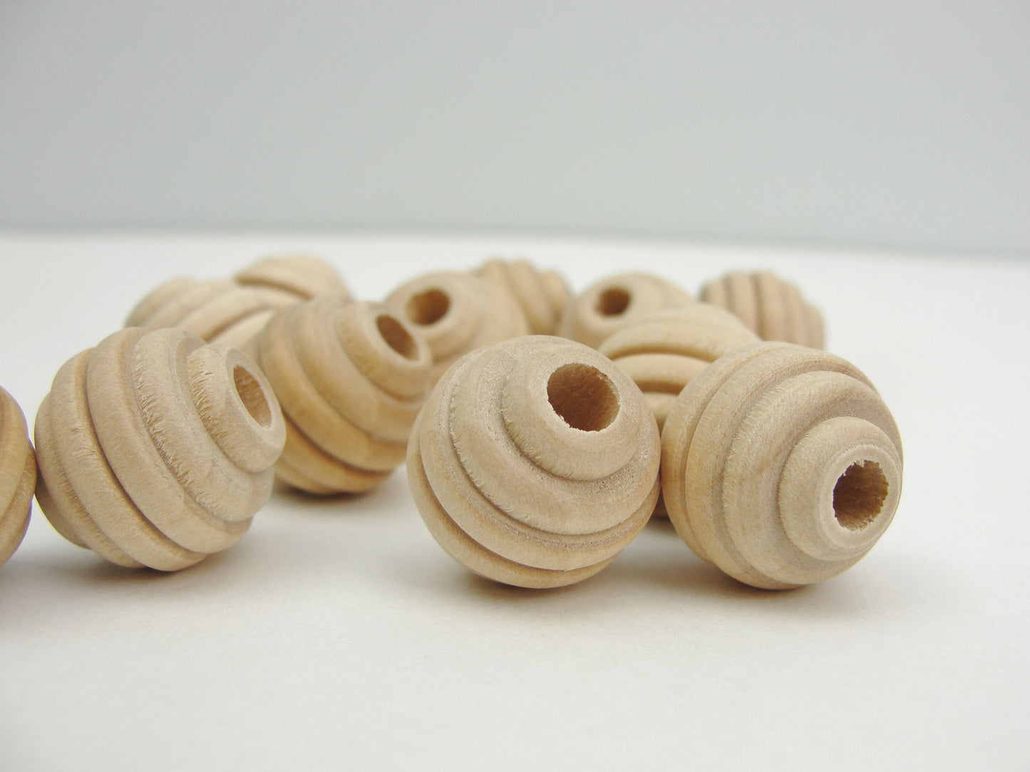 Wood beehive beads 5/8" with a 3/16" hole - Wood parts - Craft Supply House
