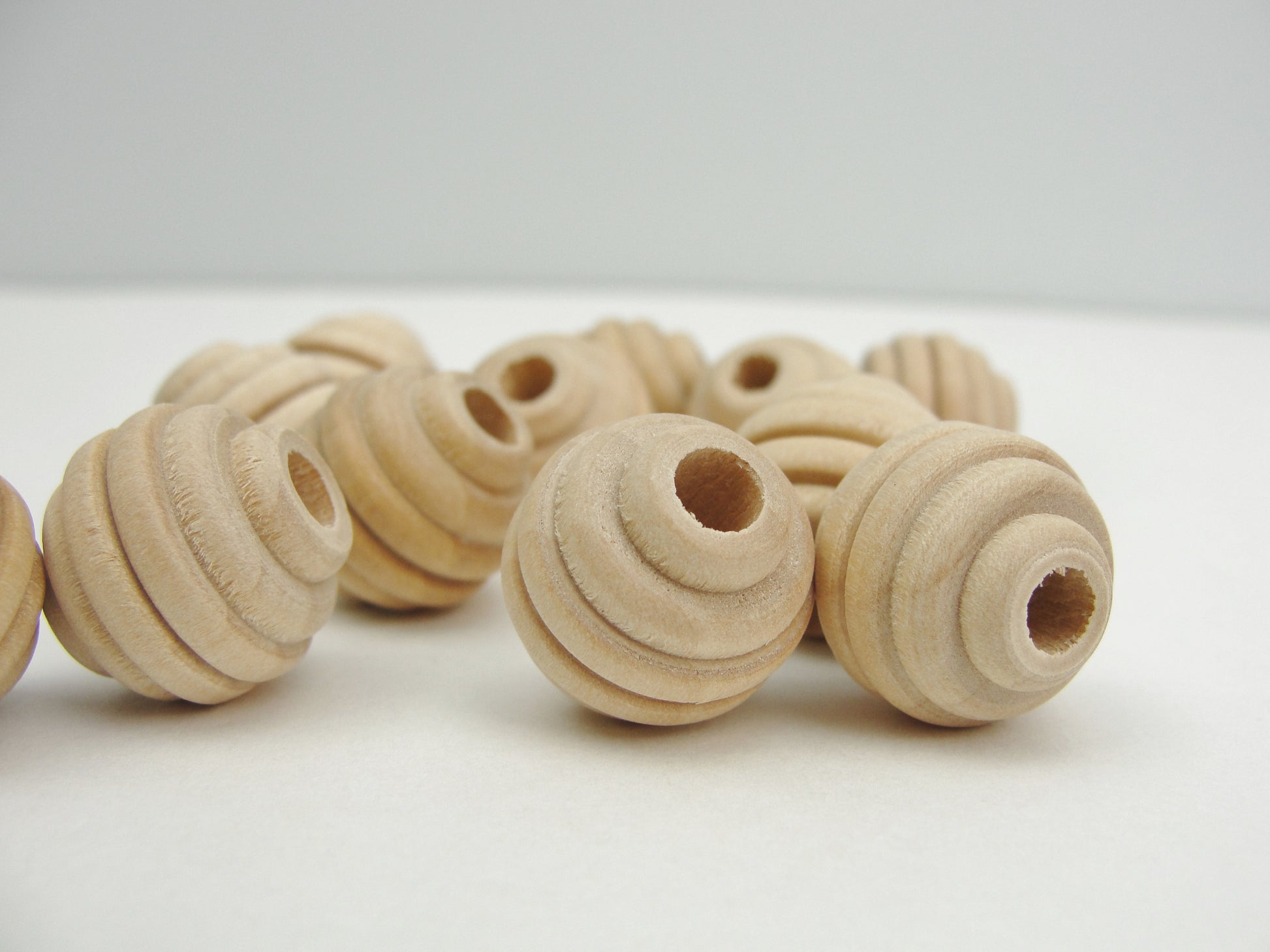Wood beehive beads 5/8" with a 3/16" hole - Wood parts - Craft Supply House