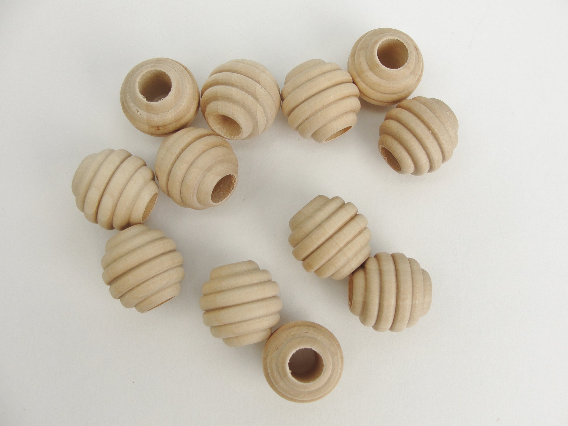 3/4" Wooden beehive beads with a 5/16" hole - Wood parts - Craft Supply House