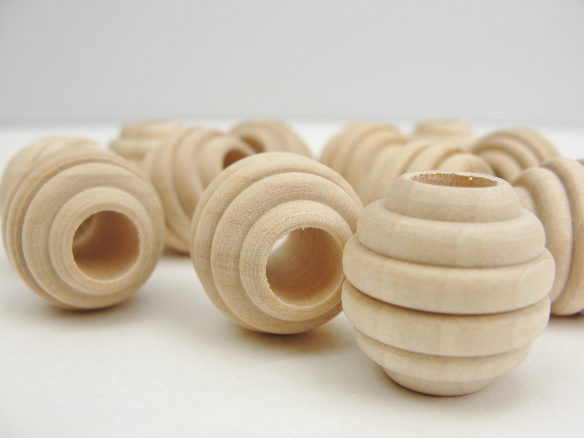 3/4" Wooden beehive beads with a 5/16" hole - Wood parts - Craft Supply House