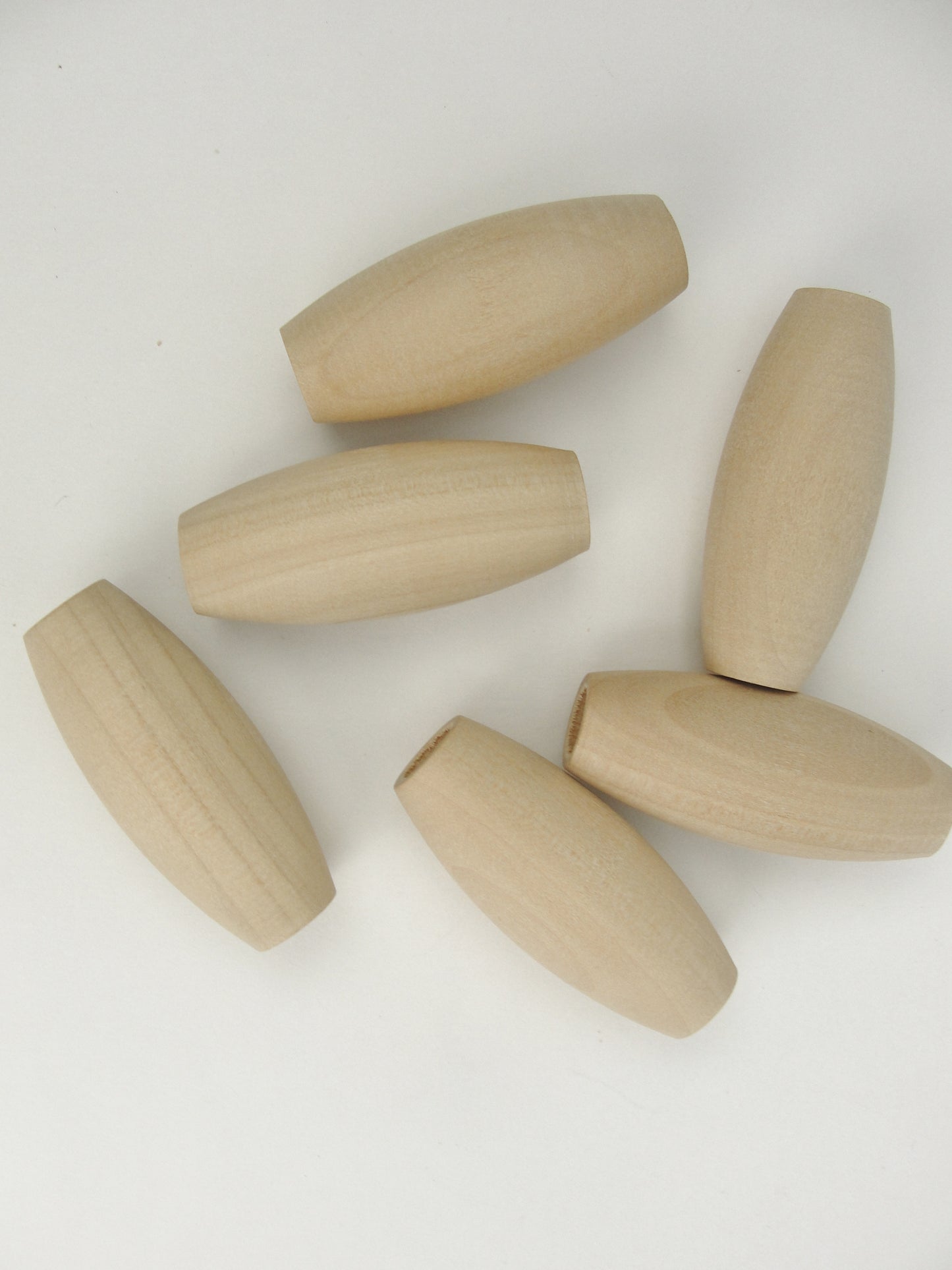 Wooden oval beads 2" x 7/8" with a 3/8" hole - Wood parts - Craft Supply House