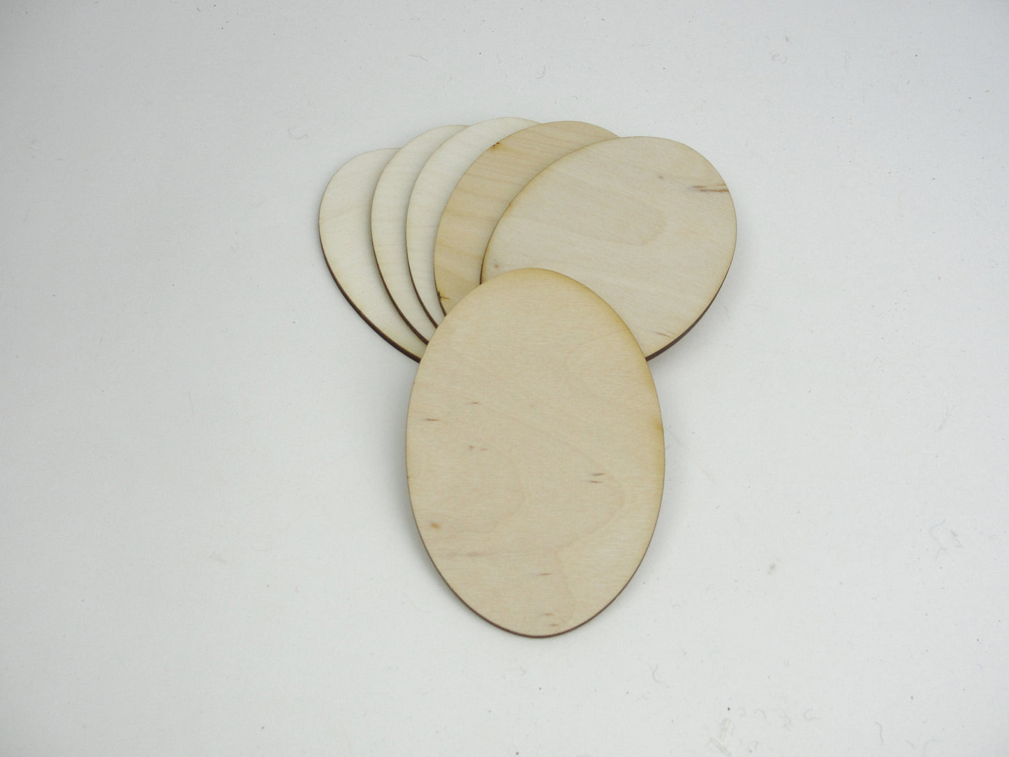 Wood oval disc 4 3/8" x 2 7/8" set of 6