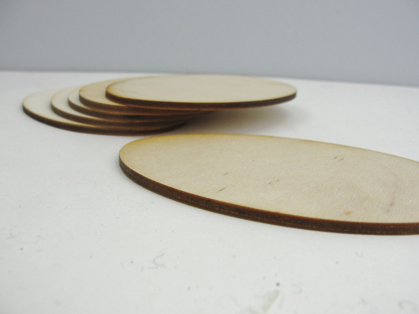 Wood oval disc 4 3/8" x 2 7/8" set of 6