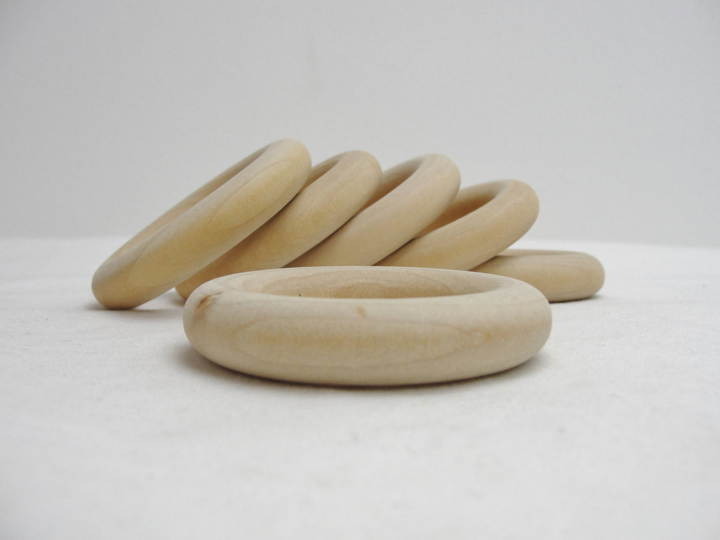 6 Wooden rings 2 1/2" with 1 1/2" inside dimension - Wood parts - Craft Supply House