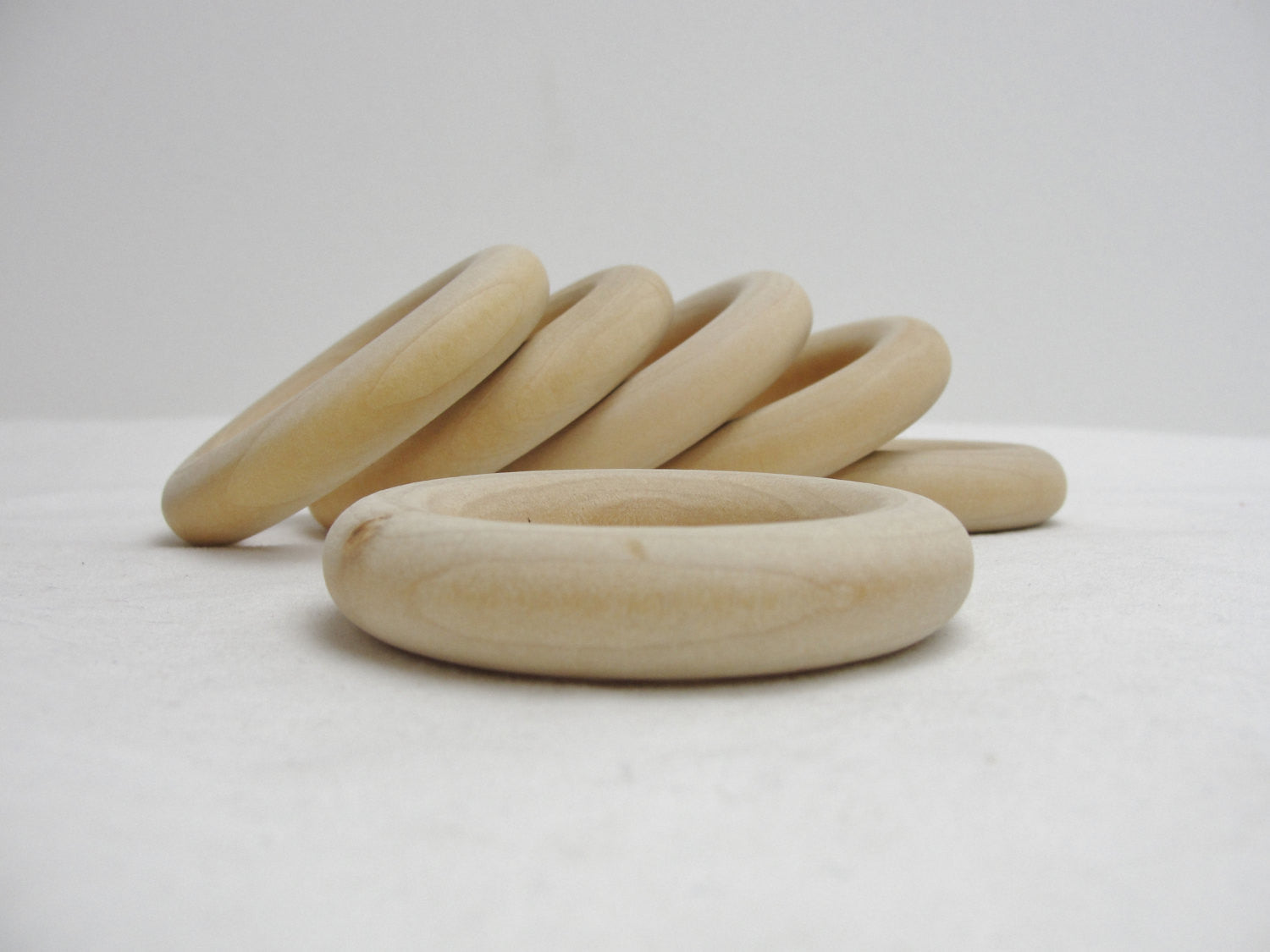 6 Wooden rings 2 1/2" with 1 1/2" inside dimension - Wood parts - Craft Supply House