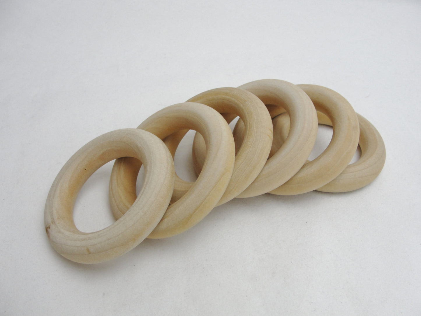 6 Wooden rings 2 1/2" with 1 1/2" inside dimension - Wood parts - Craft Supply House