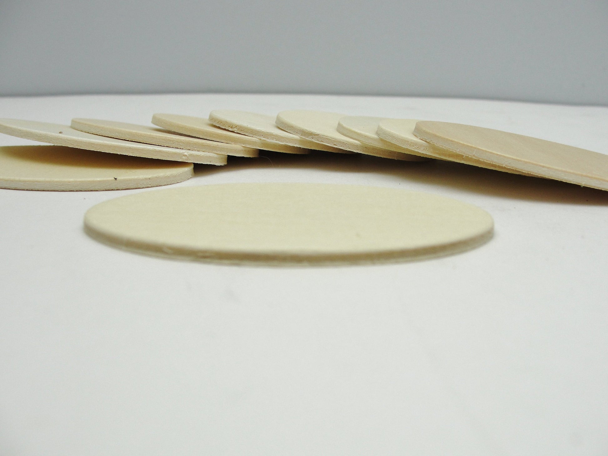 Wood oval disc 2 3/4" x 1 3/4" set of 10 - Wood parts - Craft Supply House