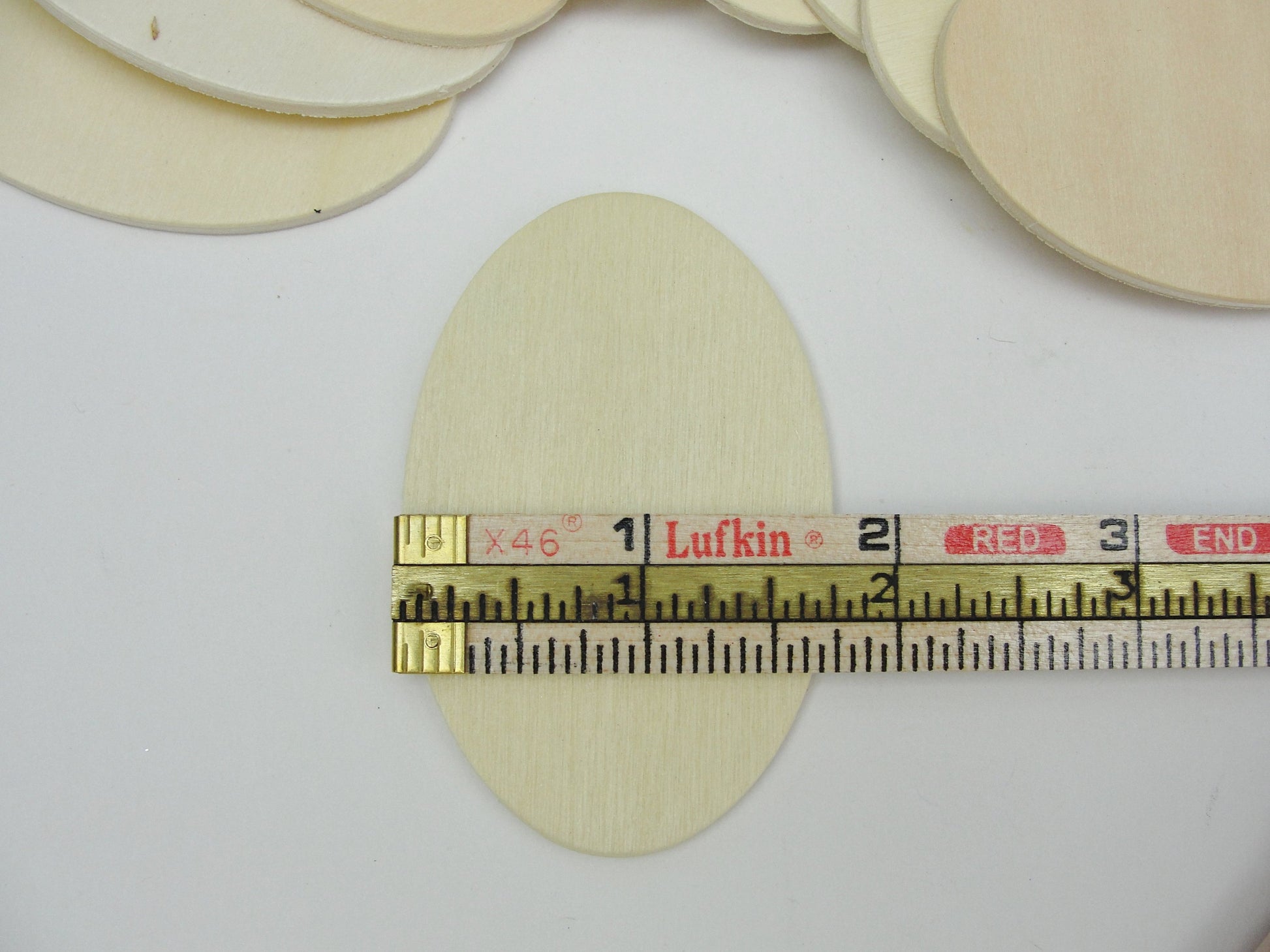 Wood oval disc 2 3/4" x 1 3/4" set of 10 - Wood parts - Craft Supply House