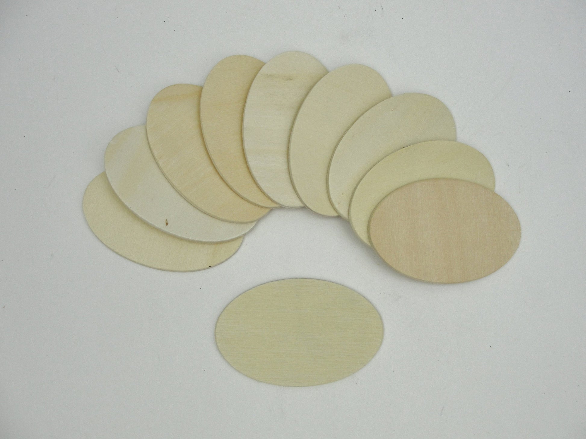 Wood oval disc 2 3/4" x 1 3/4" set of 10 - Wood parts - Craft Supply House