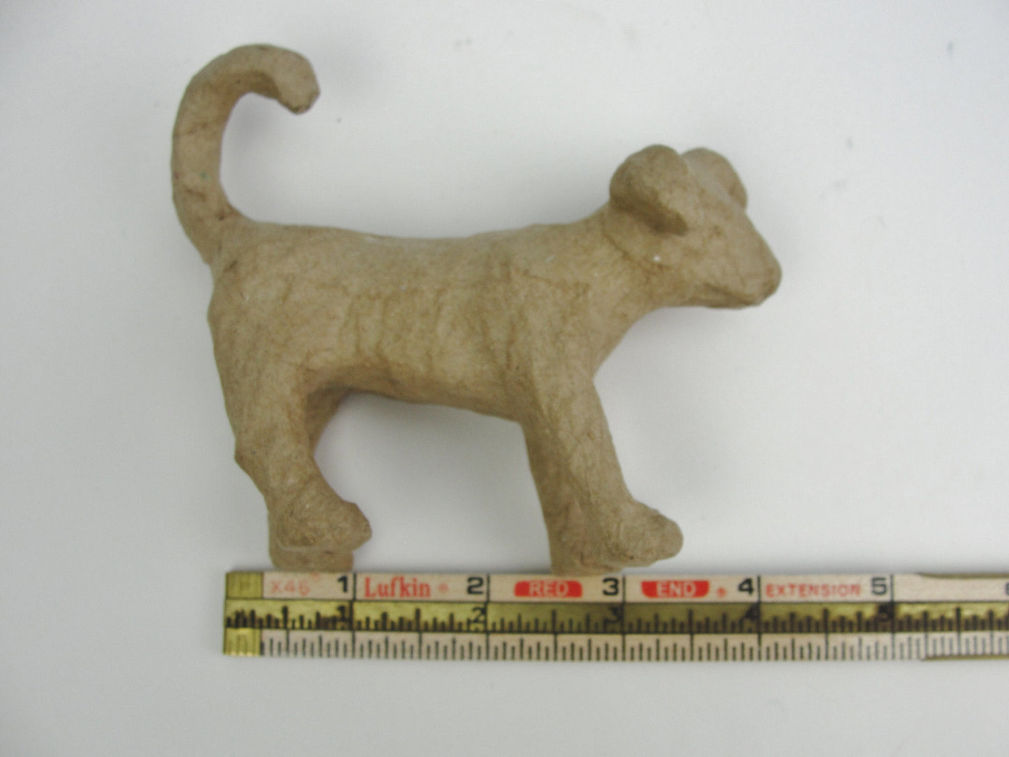 Small Paper mache Dog with curled tail