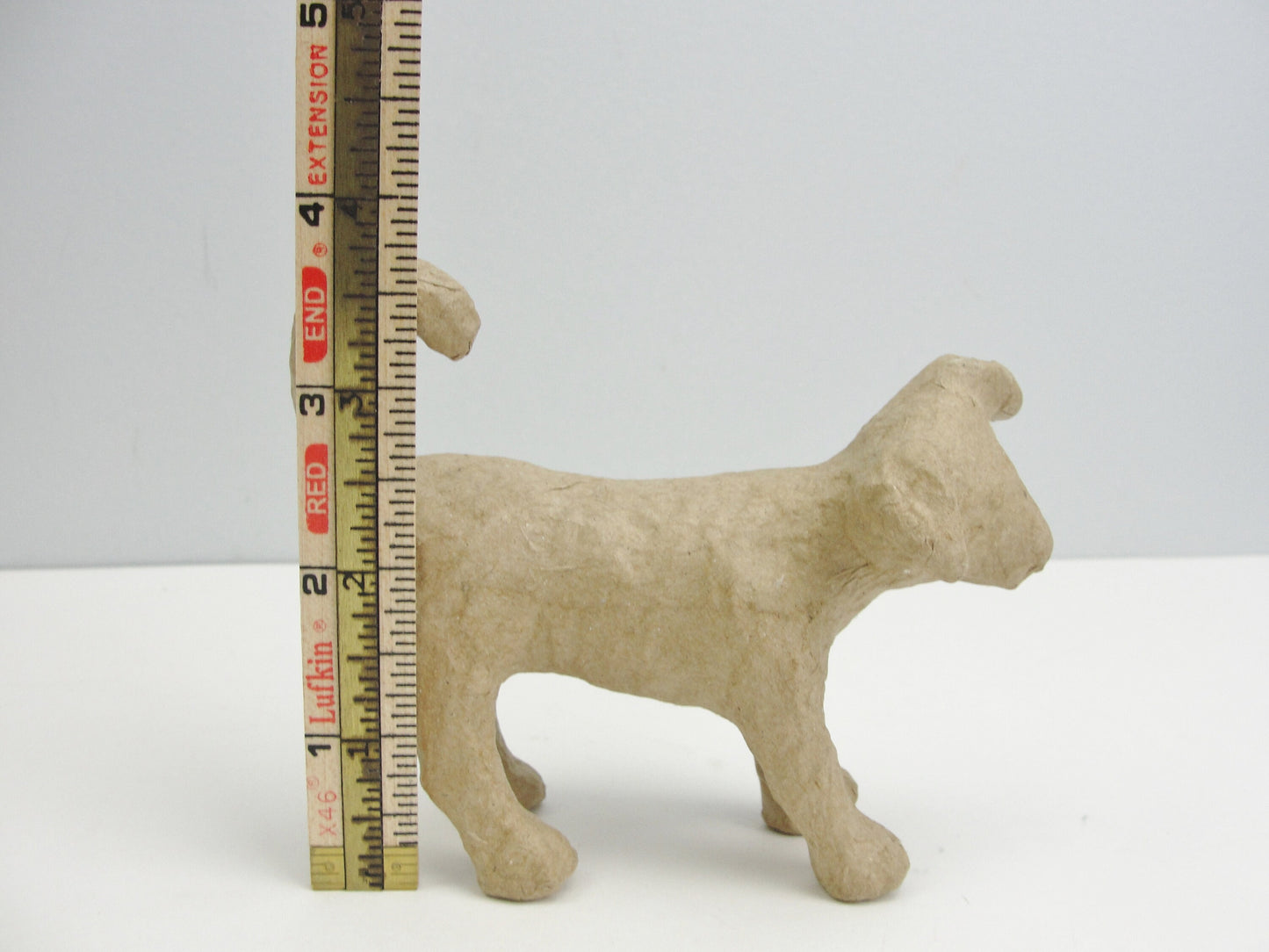 Small Paper mache Dog with curled tail