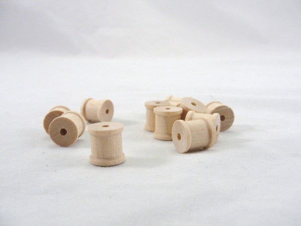 Little wooden spools 1/2 inch set of 12 - Wood parts - Craft Supply House
