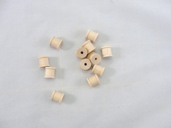 Little wooden spools 1/2 inch set of 12 - Wood parts - Craft Supply House