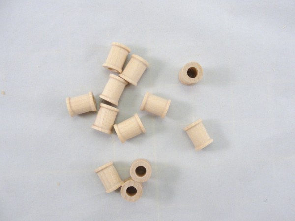 Little wooden spools 5/8 inch set of 12 - Wood parts - Craft Supply House