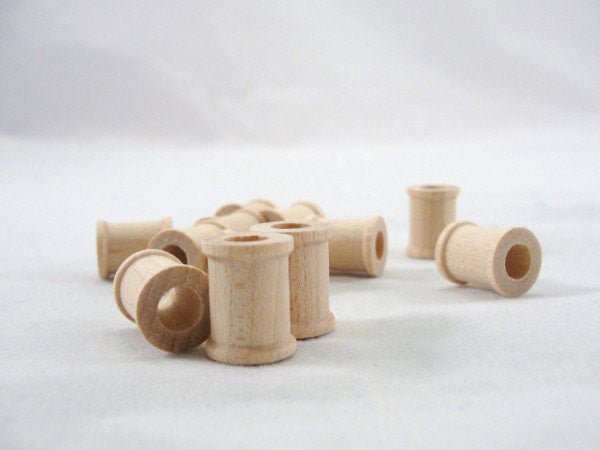 Little wooden spools 5/8 inch set of 12 - Wood parts - Craft Supply House