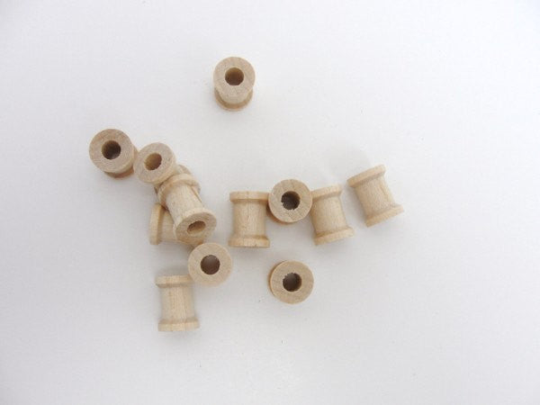 Miniature wooden spools 5/8 inch set of 12 - Wood parts - Craft Supply House