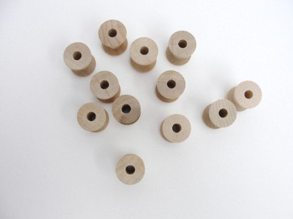 12 Wooden spools 11/8" tall - Wood parts - Craft Supply House