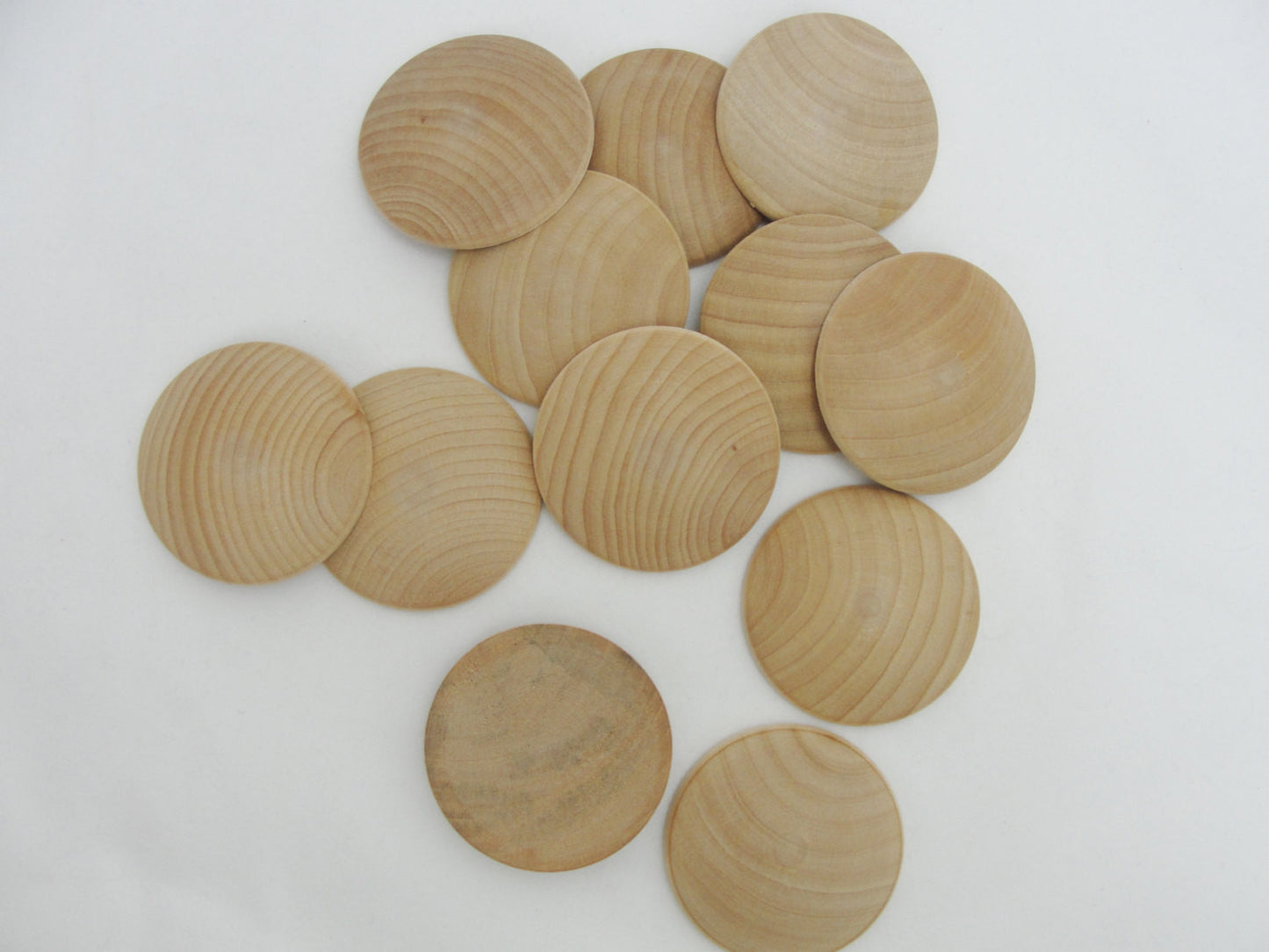 Domed wood disc 2" wide x 5/16" thick set of 12 - Wood parts - Craft Supply House