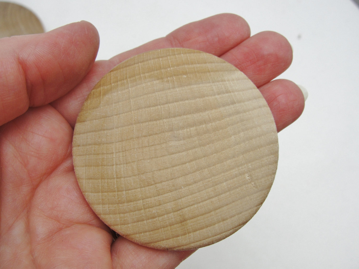 Large Wooden domed disc 2 1/4" wide x 5/16" thick set of 12 - Wood parts - Craft Supply House