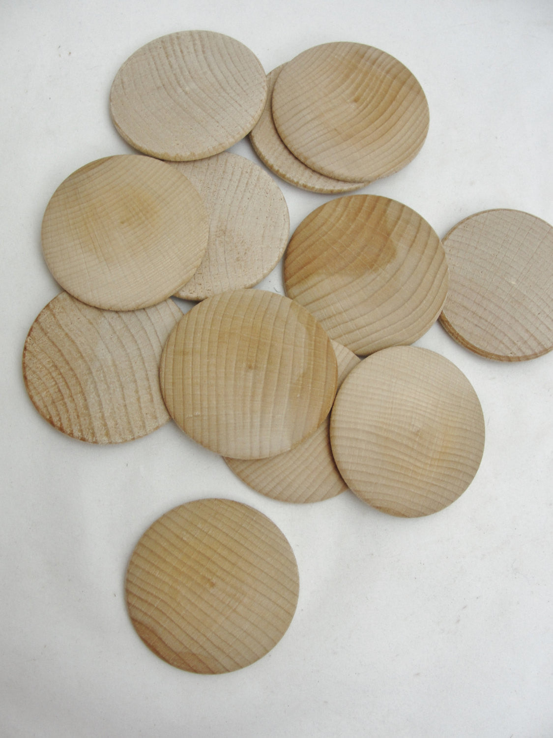 Large Wooden domed disc 2 1/4" wide x 5/16" thick set of 12 - Wood parts - Craft Supply House