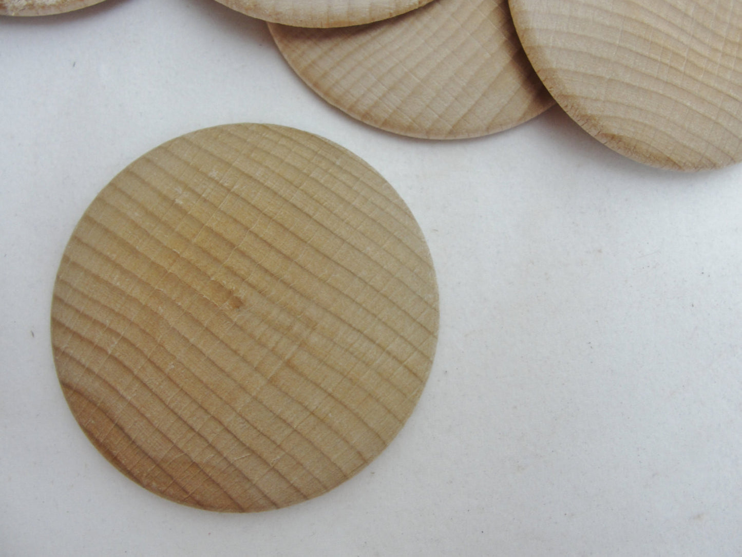 Large Wooden domed disc 2 1/4" wide x 5/16" thick set of 12 - Wood parts - Craft Supply House