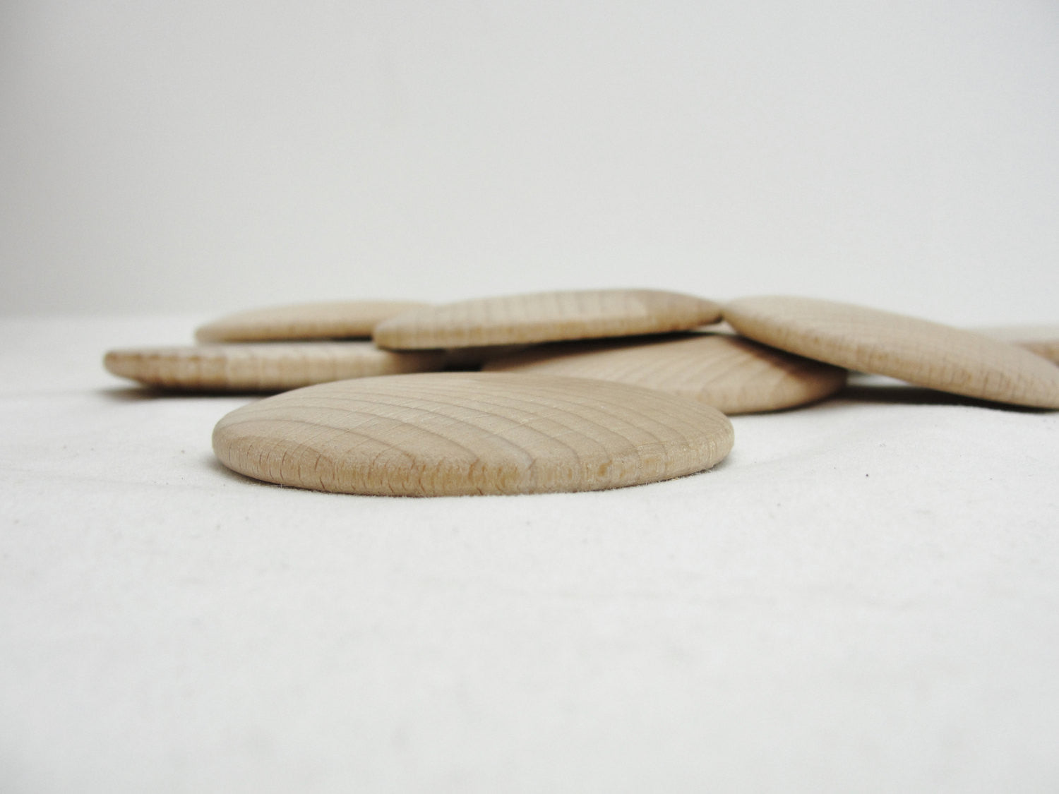 Large Wooden domed disc 2 1/4" wide x 5/16" thick set of 12 - Wood parts - Craft Supply House