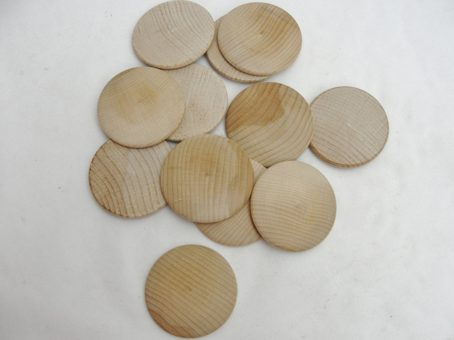 Large Wooden domed disc 2 1/4" wide x 5/16" thick set of 12 - Wood parts - Craft Supply House