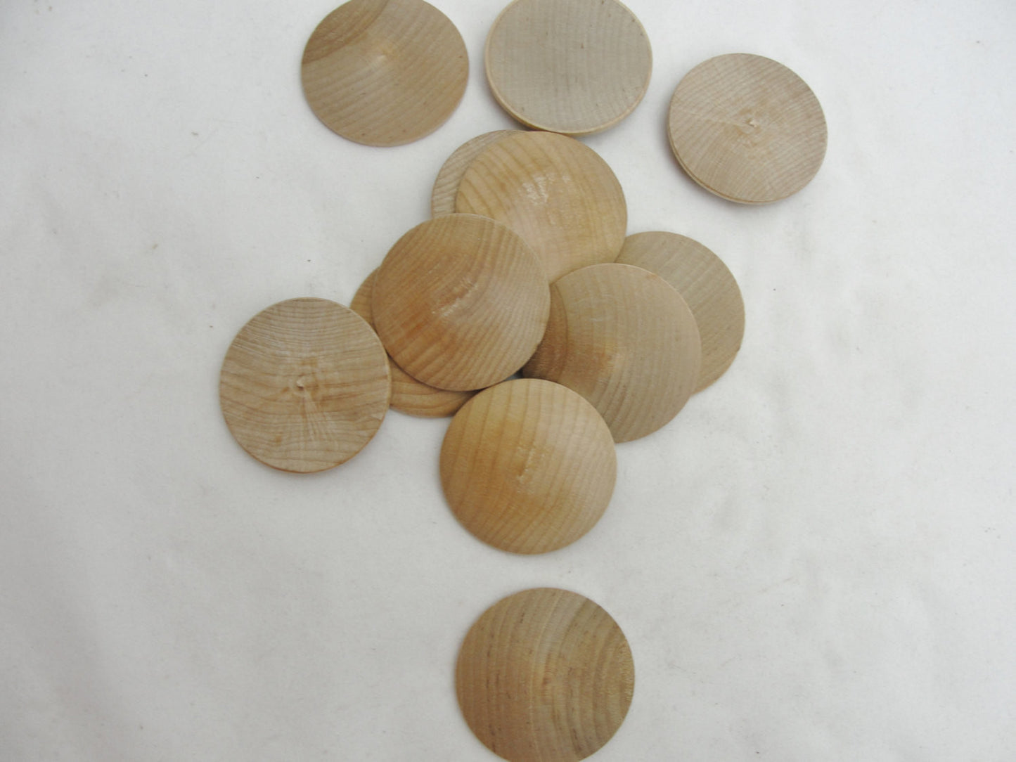 Wooden domed disc 1 3/4" wide x 5/16" thick set of 12 - Wood parts - Craft Supply House