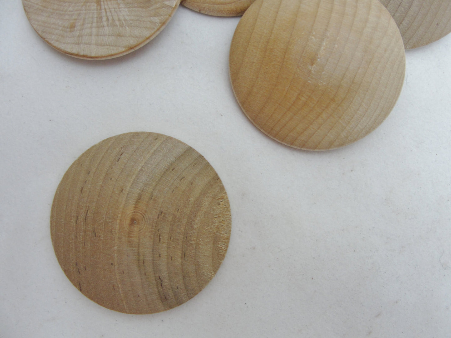 Wooden domed disc 1 3/4" wide x 5/16" thick set of 12 - Wood parts - Craft Supply House