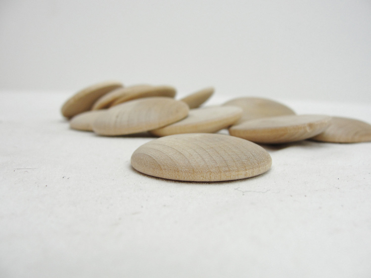 Wooden domed disc 1 1/4" wide x  5/16" thick set of 12 - Wood parts - Craft Supply House