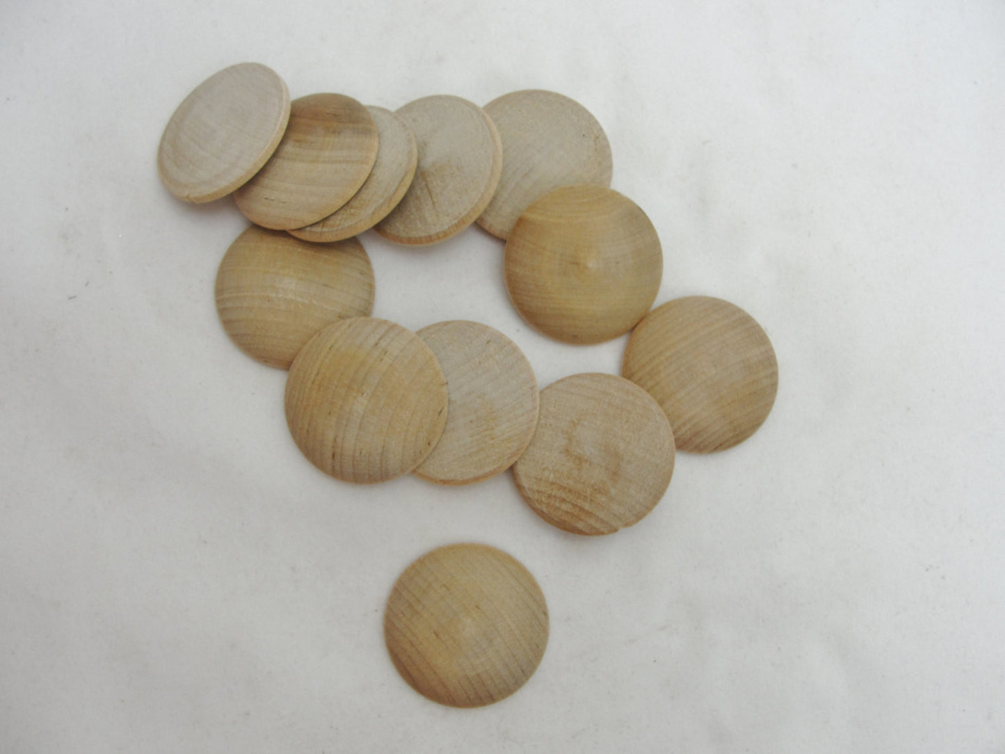 Wooden domed disc 1 1/4" wide x  5/16" thick set of 12 - Wood parts - Craft Supply House